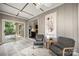 Sunroom featuring tile floors, a ceiling fan, sliding glass doors and large windows overlooking the serene backyard at 7 Turtle Ln, Clover, SC 29710