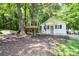 Exterior view showcasing playhouse with swing and slide, perfect for Gathering enjoyment at 7328 S Providence Rd, Waxhaw, NC 28173