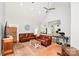 Bright, open living room with hardwood floors and ceiling fan at 7328 S Providence Rd, Waxhaw, NC 28173