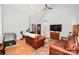 Spacious living room featuring hardwood floors, neutral paint, and ample natural light at 7328 S Providence Rd, Waxhaw, NC 28173