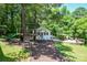 Charming playhouse with slide and swing, perfect for outdoor fun and relaxation at 7328 S Providence Rd, Waxhaw, NC 28173