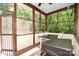 Enjoy the outdoors from this screened porch with wood flooring and ceiling fan at 7328 S Providence Rd, Waxhaw, NC 28173