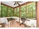 Charming screened porch featuring table with chairs and a Blackstone grill at 7328 S Providence Rd, Waxhaw, NC 28173