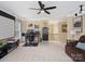The bonus room features a projector screen, neutral walls, and a comfortable seating area, perfect for relaxation at 7627 Woodcrest Dr, Stanley, NC 28164