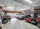 Spacious garage featuring a car, golf cart, and ample storage space at 7627 Woodcrest Dr, Stanley, NC 28164
