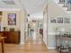 Hallway with hardwood floors leading to kitchen and living areas at 7627 Woodcrest Dr, Stanley, NC 28164