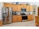 Modern kitchen equipped with stainless steel appliances, granite countertops, and white subway tile backsplash at 7627 Woodcrest Dr, Stanley, NC 28164