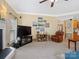 Cozy living room with a fireplace, ample seating area, neutral paint, and built-in speakers at 7627 Woodcrest Dr, Stanley, NC 28164