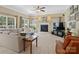 Cozy living room showcases a fireplace, large windows, and comfortable seating for relaxation at 7627 Woodcrest Dr, Stanley, NC 28164