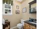 Traditional half bath features a vanity with a dark countertop at 7627 Woodcrest Dr, Stanley, NC 28164