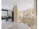 Upstairs landing with carpet floors and staircase at 7627 Woodcrest Dr, Stanley, NC 28164