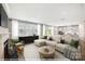Bright living room featuring a fireplace, neutral walls, modern furniture, and a seamless open-concept design at 9858 Quercus Ln, Huntersville, NC 28078