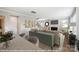 Open-concept living room boasts hardwood floors, stylish furniture, a fireplace, and seamless transition to other spaces at 9858 Quercus Ln, Huntersville, NC 28078