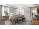 Serene bedroom featuring neutral walls, plush carpeting, soft lighting, and stylish furniture at 9858 Quercus Ln, Huntersville, NC 28078