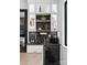 Stylish bar area complete with floating shelves, modern fixtures and a wine fridge at 120 Lakeshore Dr, Mooresville, NC 28117