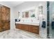 Modern bathroom with floating double sink vanity, stylish lighting and marble floors at 120 Lakeshore Dr, Mooresville, NC 28117