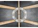 Close-up of a unique modern light fixture and patterned ceiling in this room at 120 Lakeshore Dr, Mooresville, NC 28117