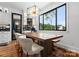 Charming dining room with natural light, stylish lighting, and wood table with seating at 120 Lakeshore Dr, Mooresville, NC 28117