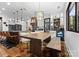 A large dining room with a wooden table, stylish lighting, and custom cabinetry at 120 Lakeshore Dr, Mooresville, NC 28117
