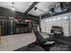 A well-organized garage with storage cabinets, shelving, and ample space for a home gym at 120 Lakeshore Dr, Mooresville, NC 28117