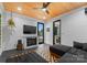 A cozy living room has wood paneling, a fireplace, and a comfortable sectional couch at 120 Lakeshore Dr, Mooresville, NC 28117