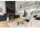 Spacious living room with a modern fireplace, high ceilings, and an open staircase to the second floor at 120 Lakeshore Dr, Mooresville, NC 28117