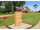 Exterior shot featuring a modern mailbox, green lawns, mature trees, and a home with a inviting driveway at 120 Lakeshore Dr, Mooresville, NC 28117