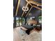 Spacious main bedroom features beamed ceiling, hardwood floors, and access to the patio at 120 Lakeshore Dr, Mooresville, NC 28117