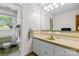 Retro bathroom featuring a green toilet, sink, and tile accents at 124 Courtney Ln, Matthews, NC 28105
