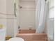 Clean bathroom with a white shower curtain and a pink bathtub at 124 Courtney Ln, Matthews, NC 28105