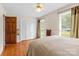Bright bedroom shows hardwood floors and a large closet at 124 Courtney Ln, Matthews, NC 28105
