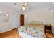 Charming bedroom features hardwood floors, closet, and a cozy quilt-covered bed at 124 Courtney Ln, Matthews, NC 28105