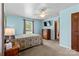 Bright bedroom featuring carpet, ceiling fan, and a large window at 124 Courtney Ln, Matthews, NC 28105