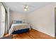Comfortable bedroom boasts hardwood floors, large window, and bright walls at 124 Courtney Ln, Matthews, NC 28105
