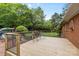 Wooden deck overlooking a backyard, complete with outdoor seating and a lush lawn at 124 Courtney Ln, Matthews, NC 28105