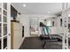 View of the home gym, including a treadmill and weights at 124 Courtney Ln, Matthews, NC 28105