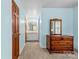 Hallway that leads to a bathroom and includes wood furniture at 124 Courtney Ln, Matthews, NC 28105