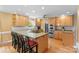 Spacious kitchen featuring an island with a gas stove, wooden cabinets, and stainless steel appliances at 124 Courtney Ln, Matthews, NC 28105