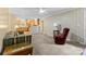 Spacious living room with a view of the kitchen and an accent chair at 124 Courtney Ln, Matthews, NC 28105