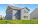 Back exterior of home with green lawn at 129 Canada Dr # 85, Statesville, NC 28166