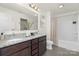 Well-lit bathroom features a double sink vanity with granite countertop and shower-tub combination at 129 Canada Dr # 85, Statesville, NC 28166