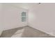 Neutral toned bedroom with one bright window at 129 Canada Dr # 85, Statesville, NC 28166