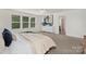 Bright bedroom featuring neutral tones, large windows, and an en-suite bathroom at 129 Canada Dr # 85, Statesville, NC 28166