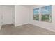 Neutral toned bedroom with two bright windows at 129 Canada Dr # 85, Statesville, NC 28166