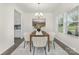 Dining room featuring a chandelier, an area rug, and a painting over the table at 129 Canada Dr # 85, Statesville, NC 28166