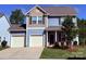 Charming two-story home with a two car garage and manicured lawn at 129 Canada Dr # 85, Statesville, NC 28166