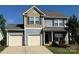 Charming two-story home featuring a two-car garage and well-maintained landscaping at 129 Canada Dr # 85, Statesville, NC 28166