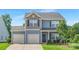 Charming two-story home featuring light blue siding, a two-car garage, and a welcoming front entrance at 129 Canada Dr # 85, Statesville, NC 28166