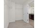 Empty walk-in closet with wire shelving and access to an en-suite bathroom at 129 Canada Dr # 85, Statesville, NC 28166