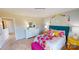 Well-lit bedroom with colorful décor, a vibrant bedspread, and a large dresser at 133 Way Cross Ln, Troutman, NC 28166